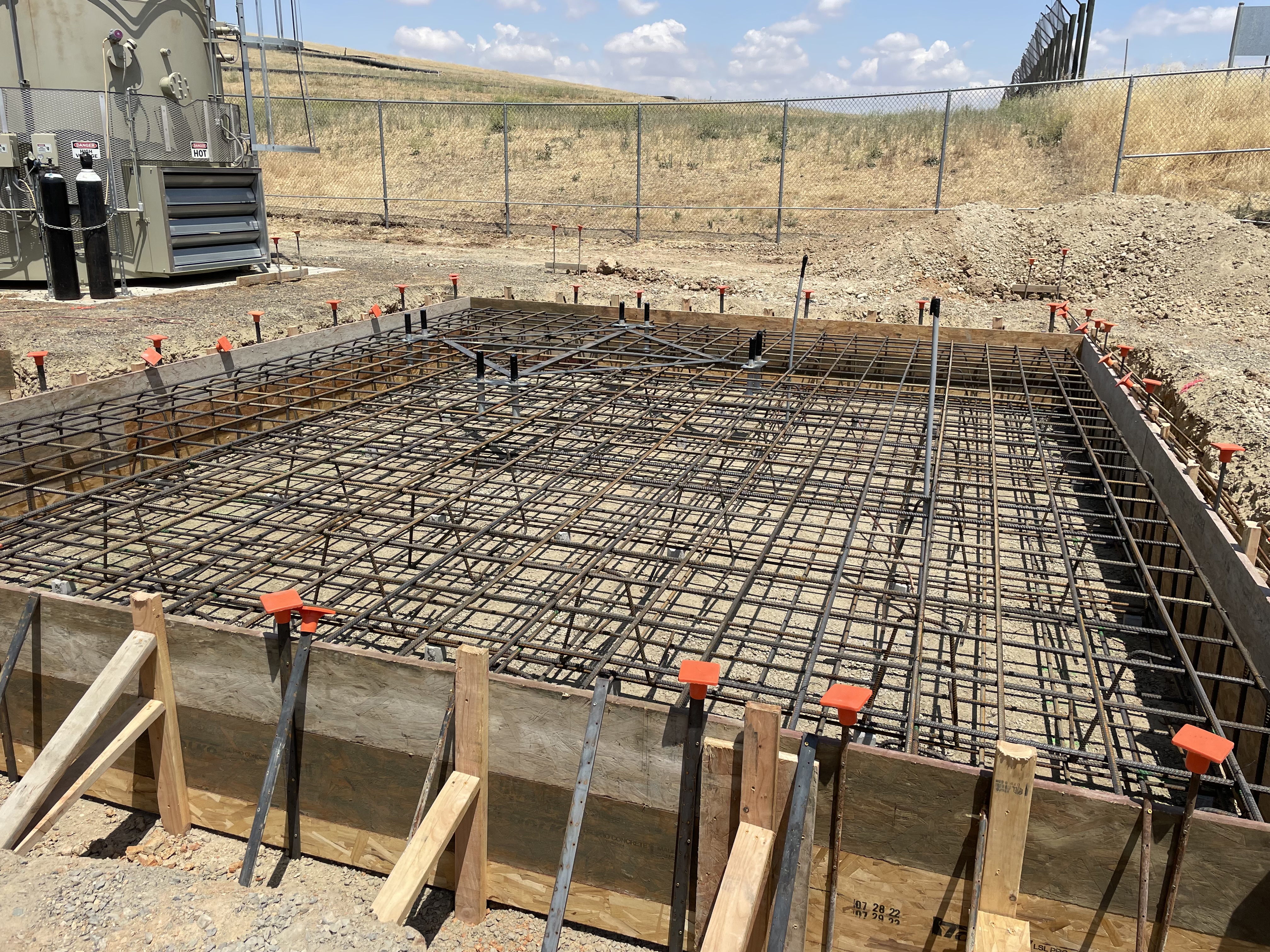 Foundation rebar grid in formwork ready for concrete pour on commercial project in arid Northern California