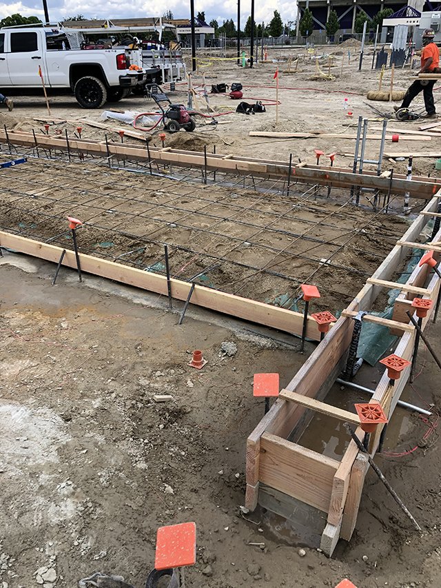 Concrete grade beam and footing construction on a commercial building project in Northern California