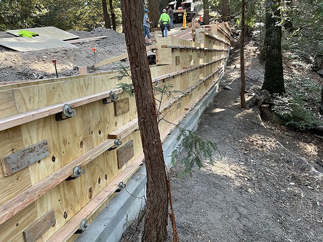 Completed cast-in-place concrete retaining wall on a commercial site in Northern California