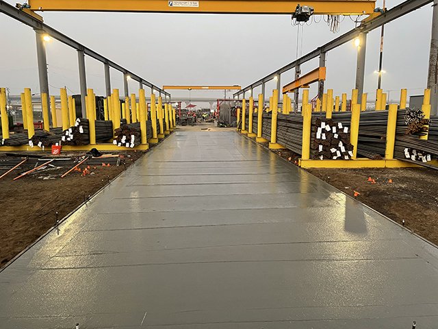 Concrete placement and vibration on a structural slab at a commercial construction project